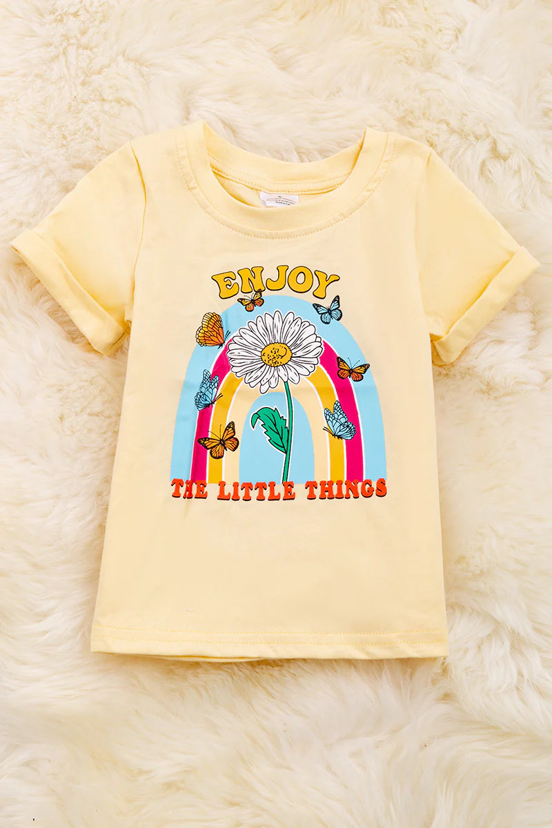 "Enjoy the little things" candle light color printed tee shirt with folded sleeves.